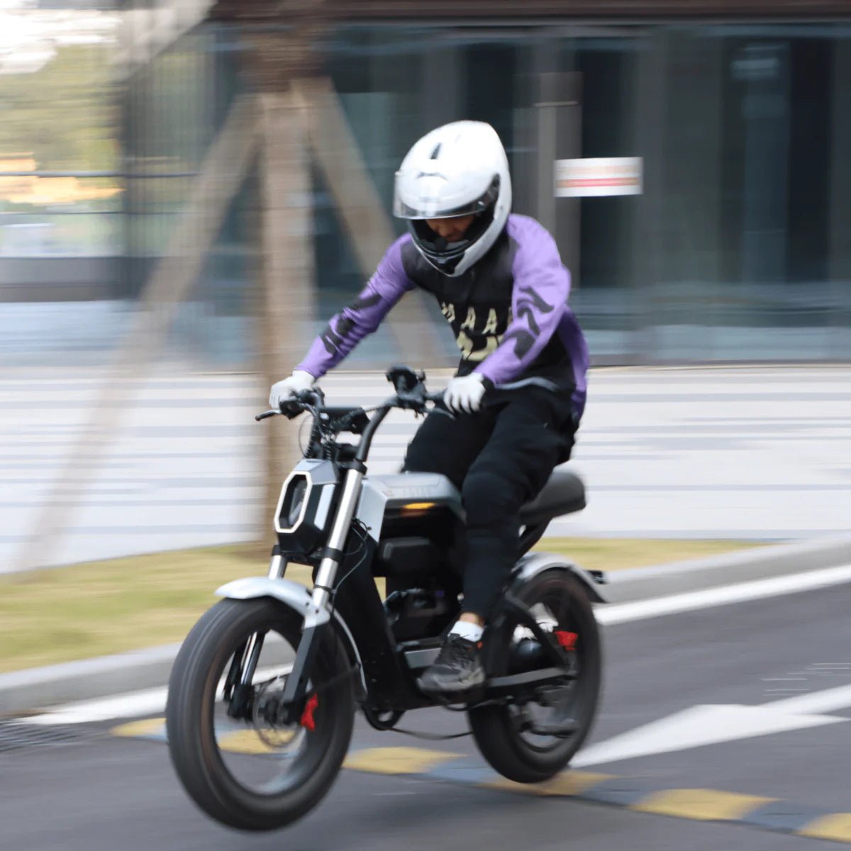 AOTOS Flux X26 electric bike in motion with 100Nm torque, fat tires and road-ready riding performance